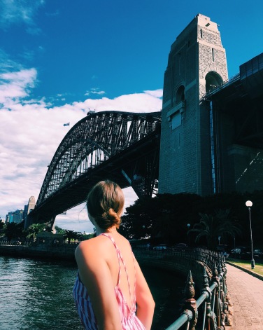 Woman dressed in pink with the Harbour Bridge as a backdrop