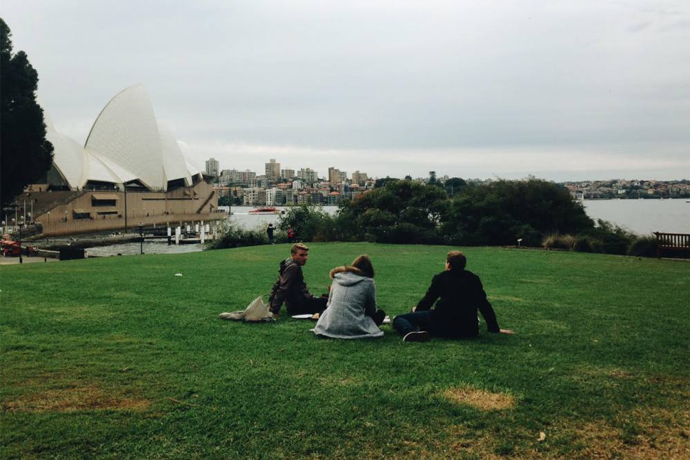 Picnic in royal botanical gardens, Sydney, in view of the Sydney Opera House.